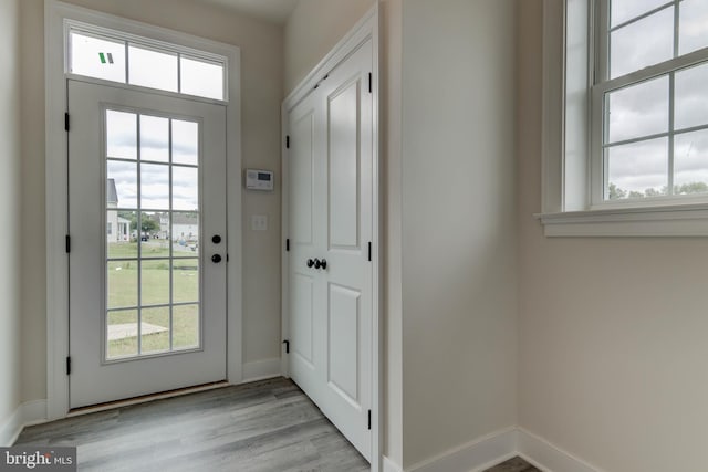 doorway to outside with light hardwood / wood-style flooring