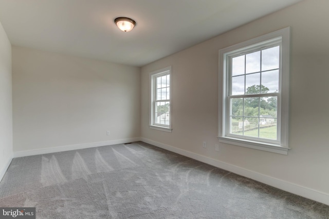 unfurnished room with carpet flooring