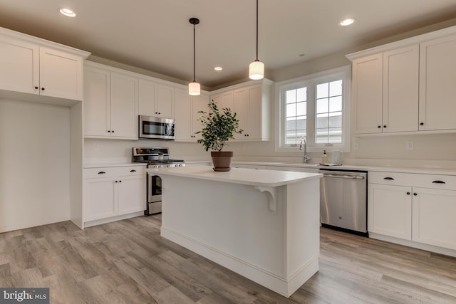 kitchen with stainless steel appliances and white cabinetry