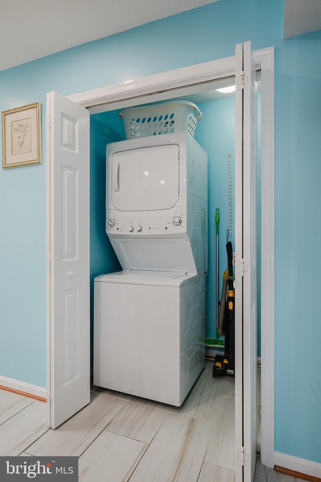 laundry room with stacked washer and clothes dryer