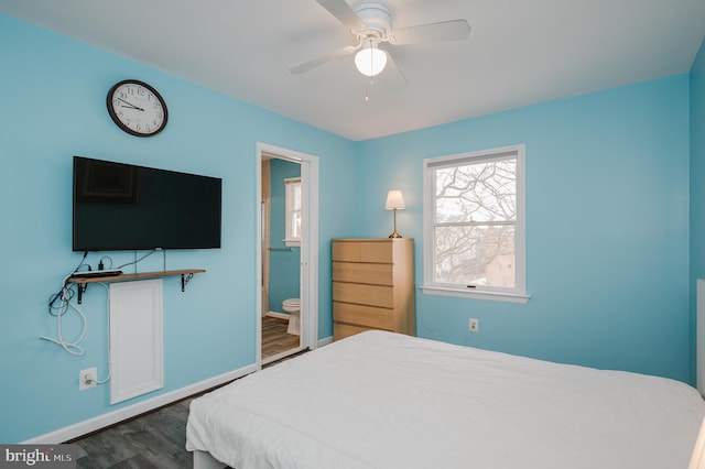 bedroom with ceiling fan, dark hardwood / wood-style flooring, and ensuite bath