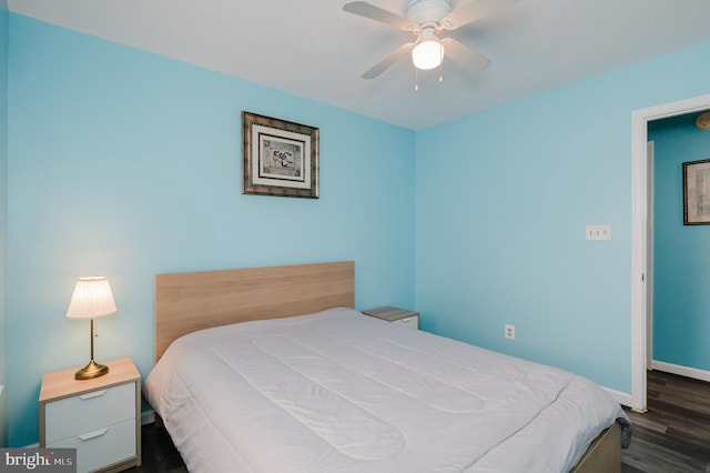 bedroom featuring dark wood-type flooring and ceiling fan