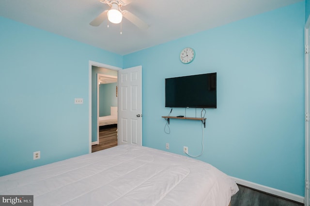 bedroom featuring hardwood / wood-style floors and ceiling fan