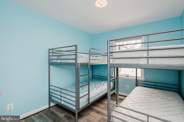 bedroom with hardwood / wood-style floors