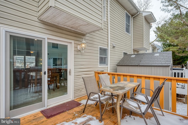 view of snow covered deck