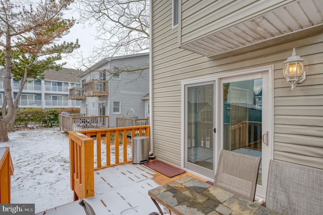 view of snow covered deck