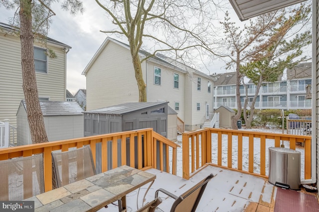 wooden deck featuring a storage shed