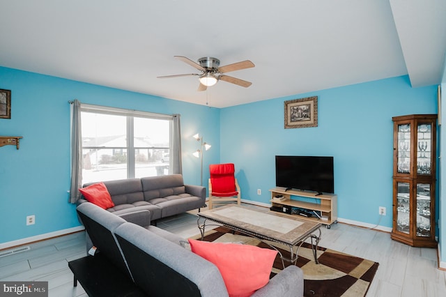 living room featuring ceiling fan and light wood-type flooring