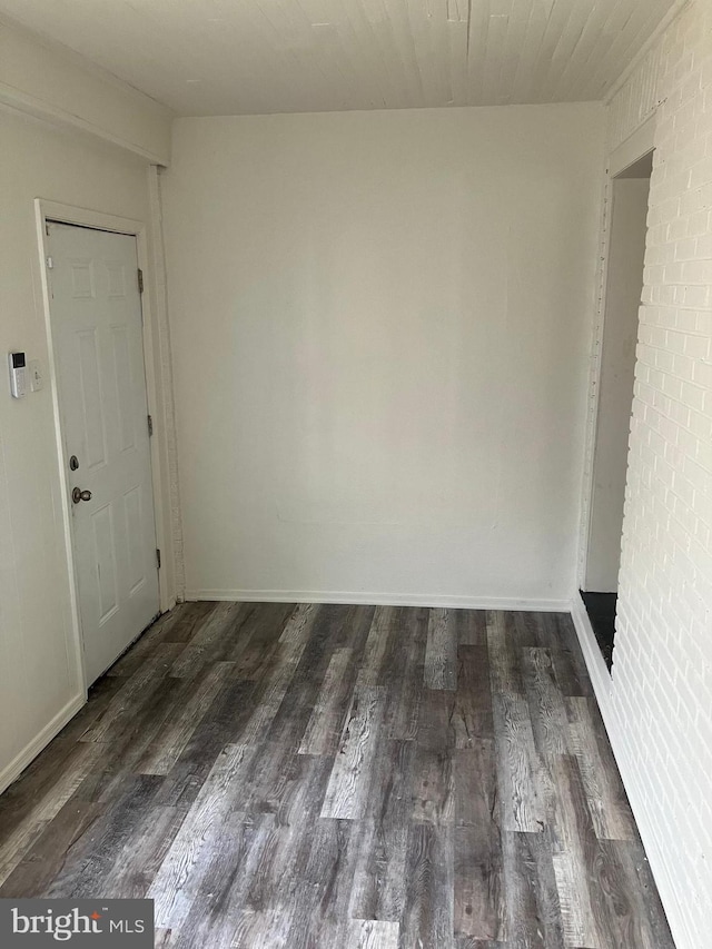 empty room featuring dark hardwood / wood-style floors