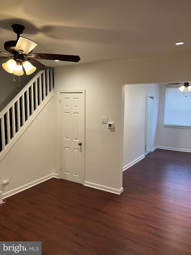 foyer with ceiling fan and dark hardwood / wood-style flooring