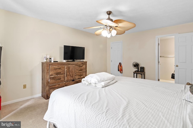 bedroom featuring a closet, carpet flooring, a ceiling fan, and baseboards