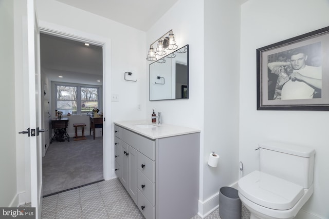 bathroom with toilet and vanity