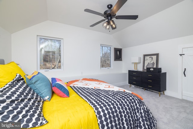 bedroom with baseboards, a ceiling fan, lofted ceiling, and carpet floors