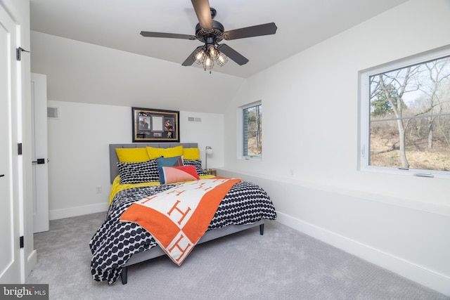 bedroom with visible vents, baseboards, carpet, and lofted ceiling