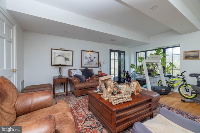 living area featuring visible vents and light wood-style flooring