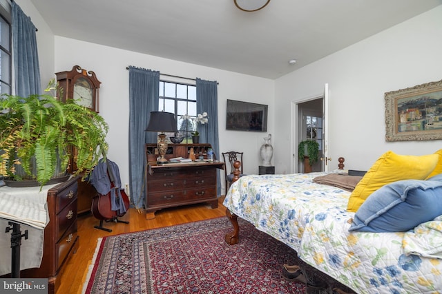 bedroom with wood finished floors