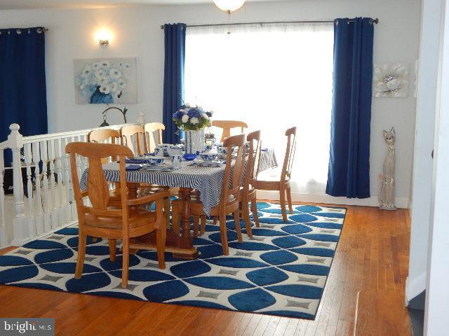 dining area featuring hardwood / wood-style flooring and a wealth of natural light