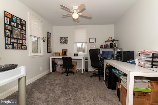 carpeted home office featuring ceiling fan