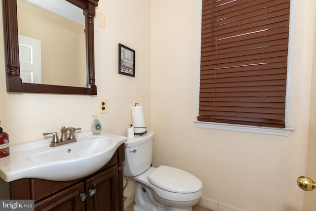 bathroom with toilet and vanity