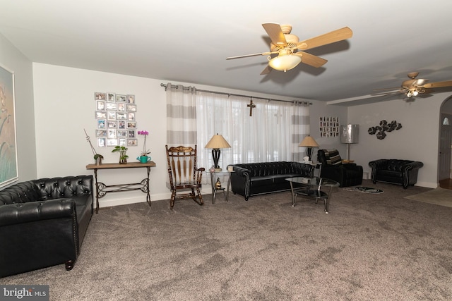 carpeted living room featuring ceiling fan