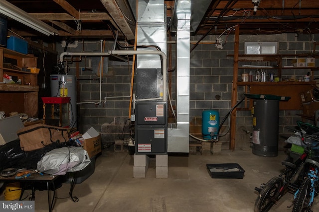 basement featuring water heater and heating unit