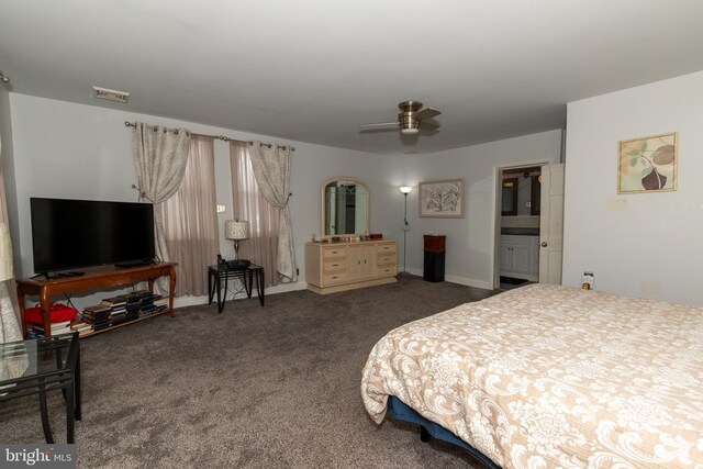 bedroom featuring ceiling fan, carpet, and ensuite bathroom