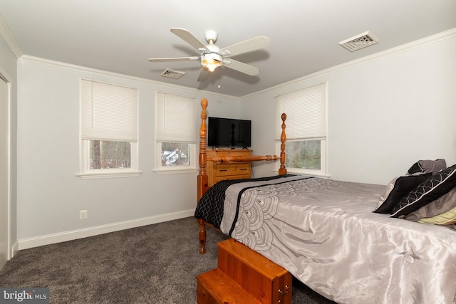 carpeted bedroom featuring ceiling fan and crown molding