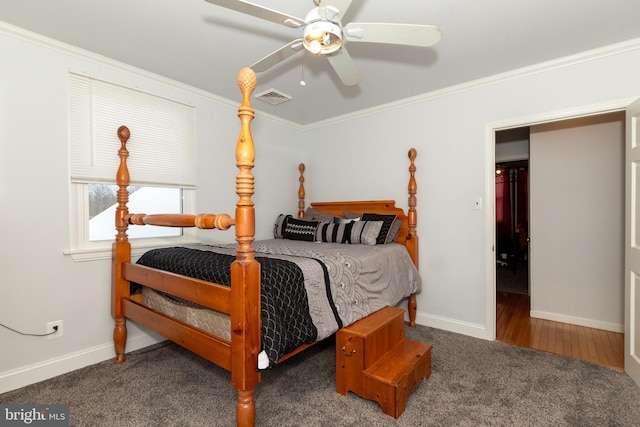 bedroom featuring ceiling fan, dark carpet, and ornamental molding