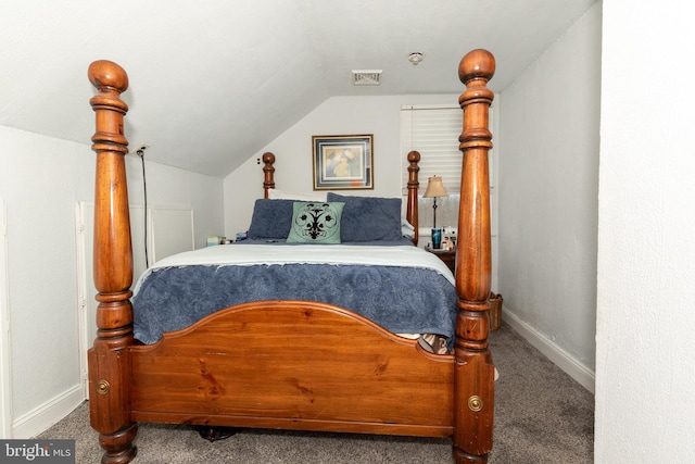 bedroom with vaulted ceiling and carpet