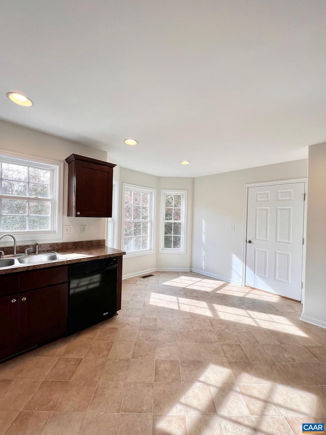 kitchen with sink, dark brown cabinetry, and dishwasher