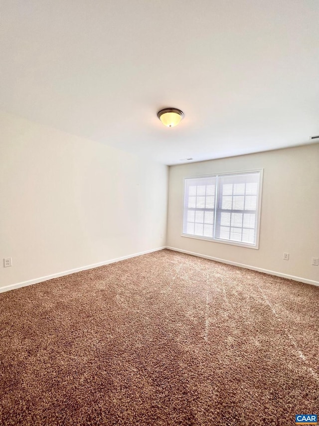 spare room with carpet floors