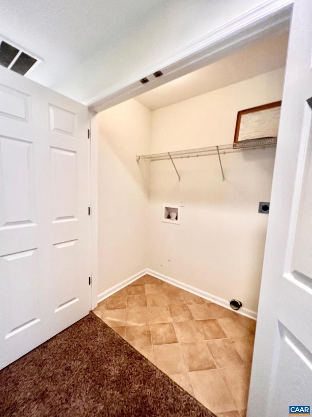 washroom featuring washer hookup and light tile patterned floors