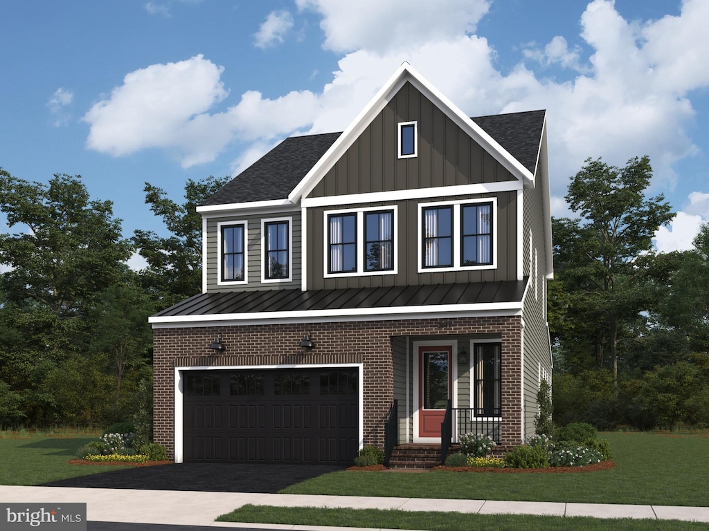 view of front of house with a garage and a front yard