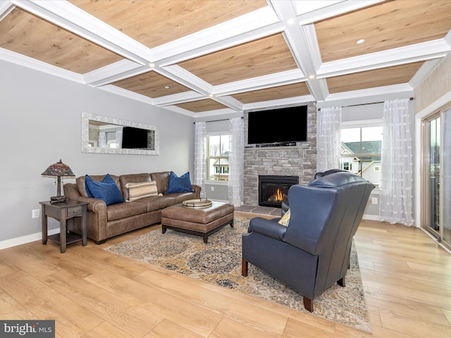 living room with coffered ceiling, light hardwood / wood-style flooring, wooden ceiling, and a stone fireplace