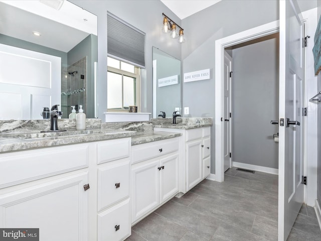 bathroom with vanity and walk in shower