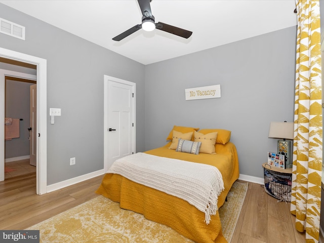 bedroom featuring ceiling fan and wood-type flooring