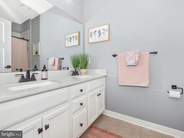 bathroom with vanity and tile patterned floors