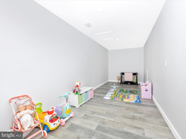 playroom with light hardwood / wood-style flooring