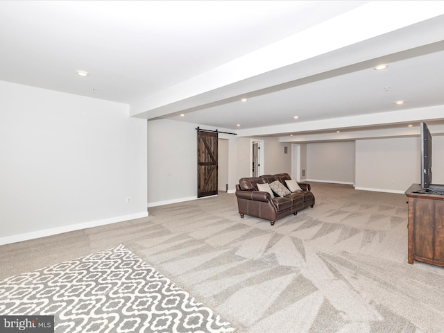 living area with light colored carpet and a barn door