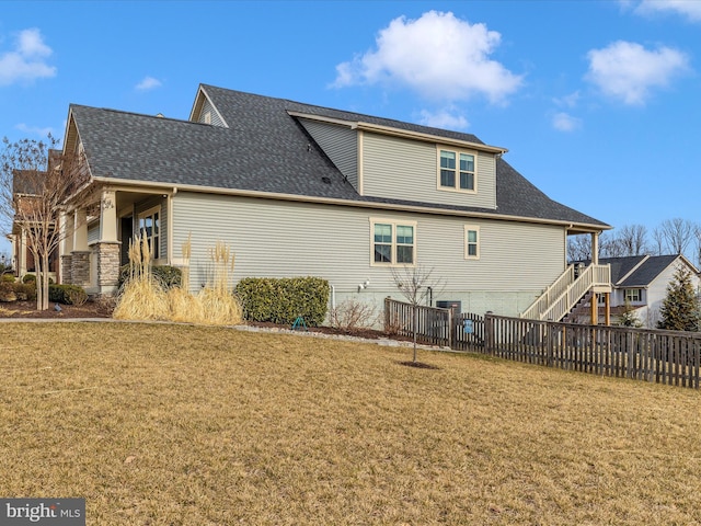 rear view of house with a lawn