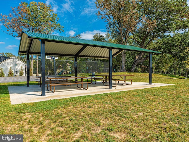 surrounding community with a lawn and a gazebo