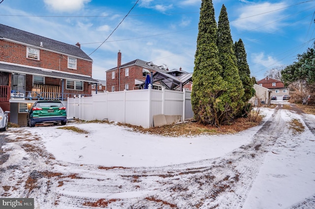 view of yard layered in snow