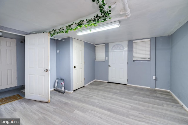 basement featuring light wood-type flooring