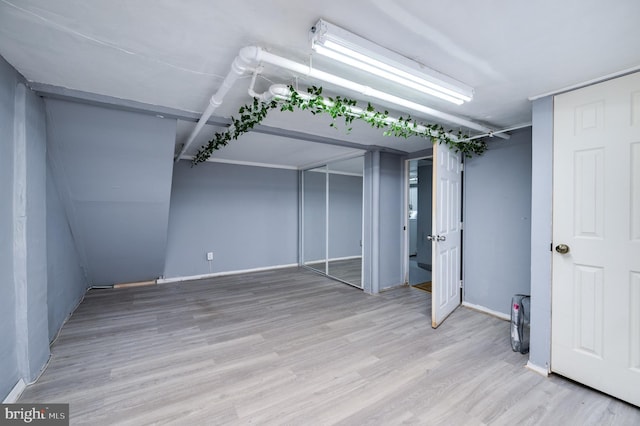 basement with light wood-type flooring