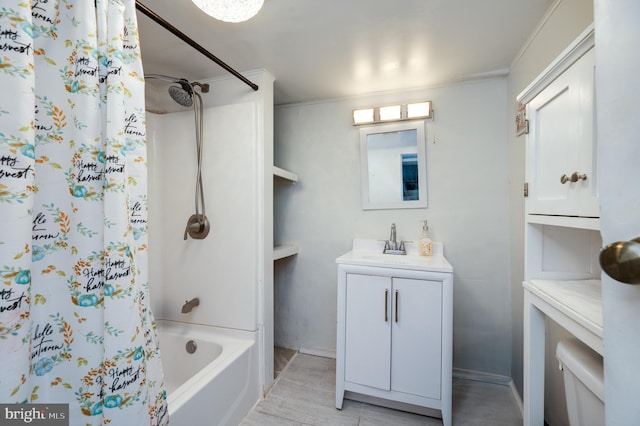 bathroom featuring ornamental molding, shower / tub combo, and vanity