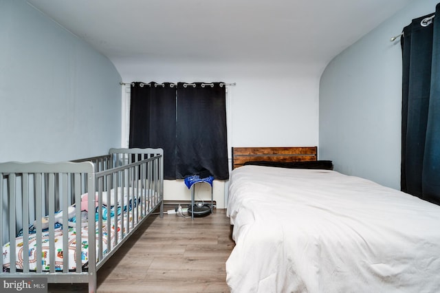 bedroom with wood-type flooring