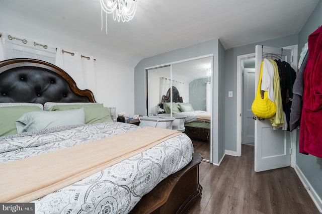 bedroom with a closet and dark hardwood / wood-style flooring