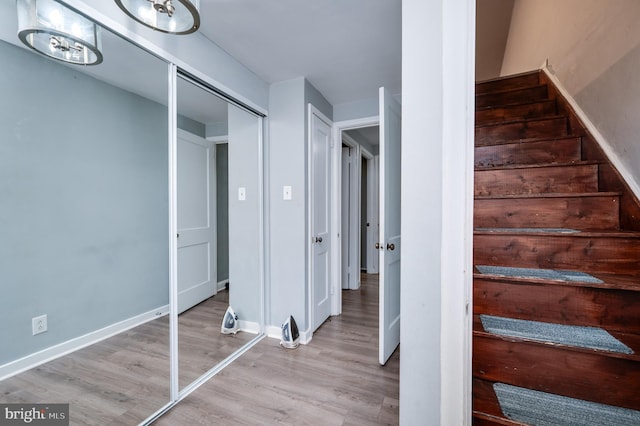 stairs with wood-type flooring