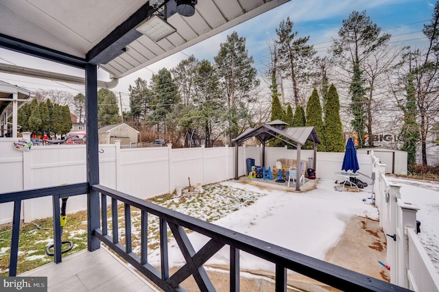 view of patio with a storage shed and a gazebo