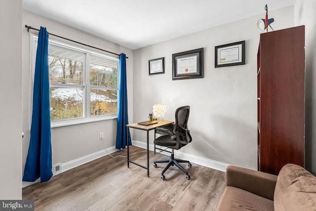 office space with hardwood / wood-style flooring